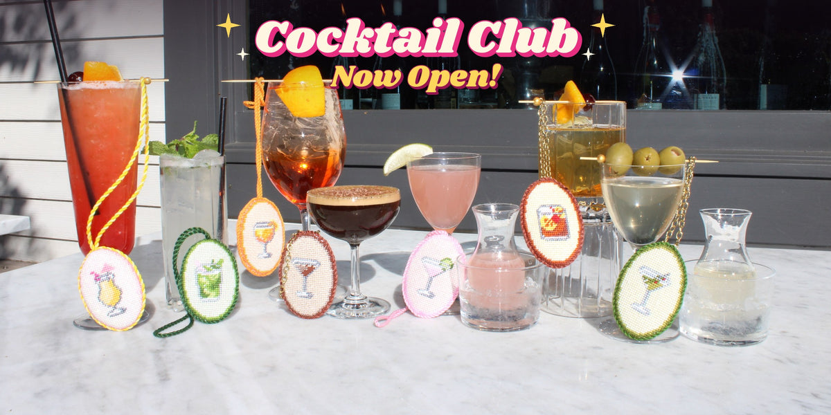 Cocktail Club now open: seven finished needlepoint cocktail ornaments with their drinks